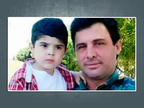 José Lucas no colo do pai, Lucas, que tomou veneno junto com a esposa após morte do filho (Folha da Região).