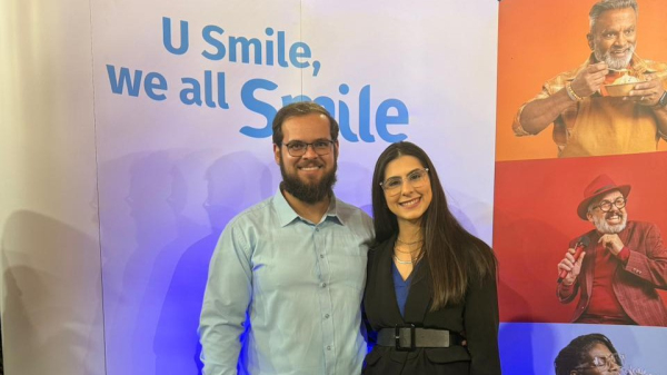 Willian Borro Gasparini e a fonoaudiologa e audiologista Anna Caroline Gasparini no evento da Unitron (Cedida).